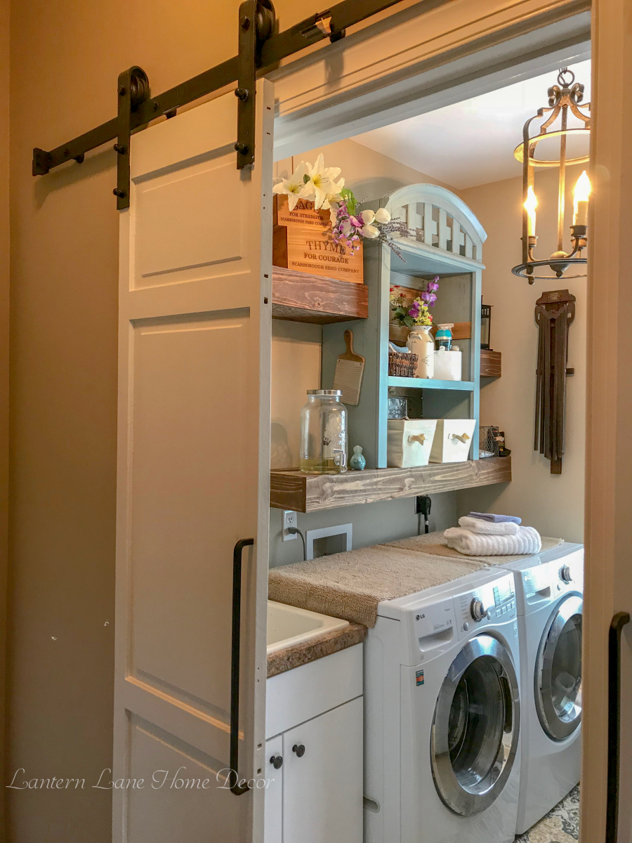 The builder grade door was removed and two smaller sliding doors were added to maximize the space in the room.