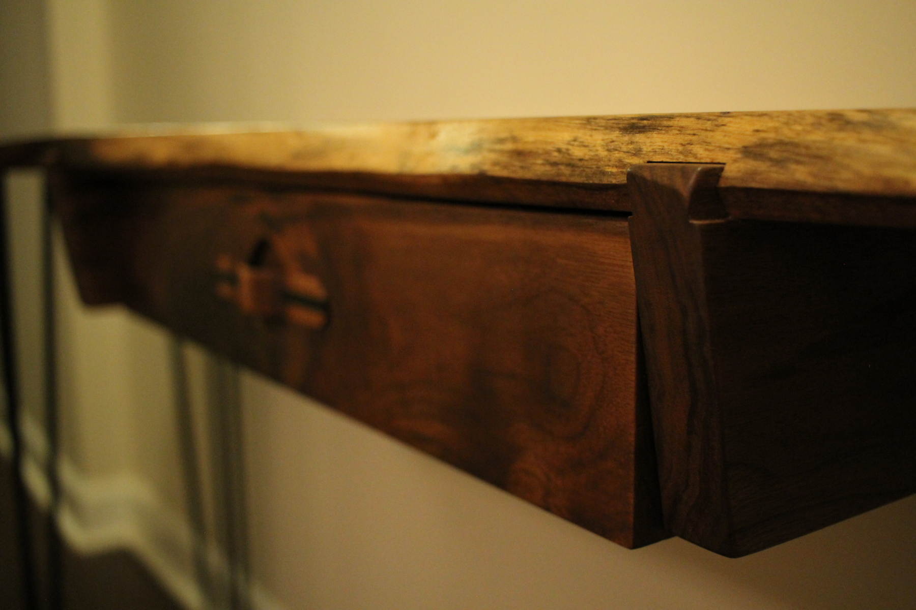 Here's a shot of the sliding dovetails inset into the slab for the drawer supports