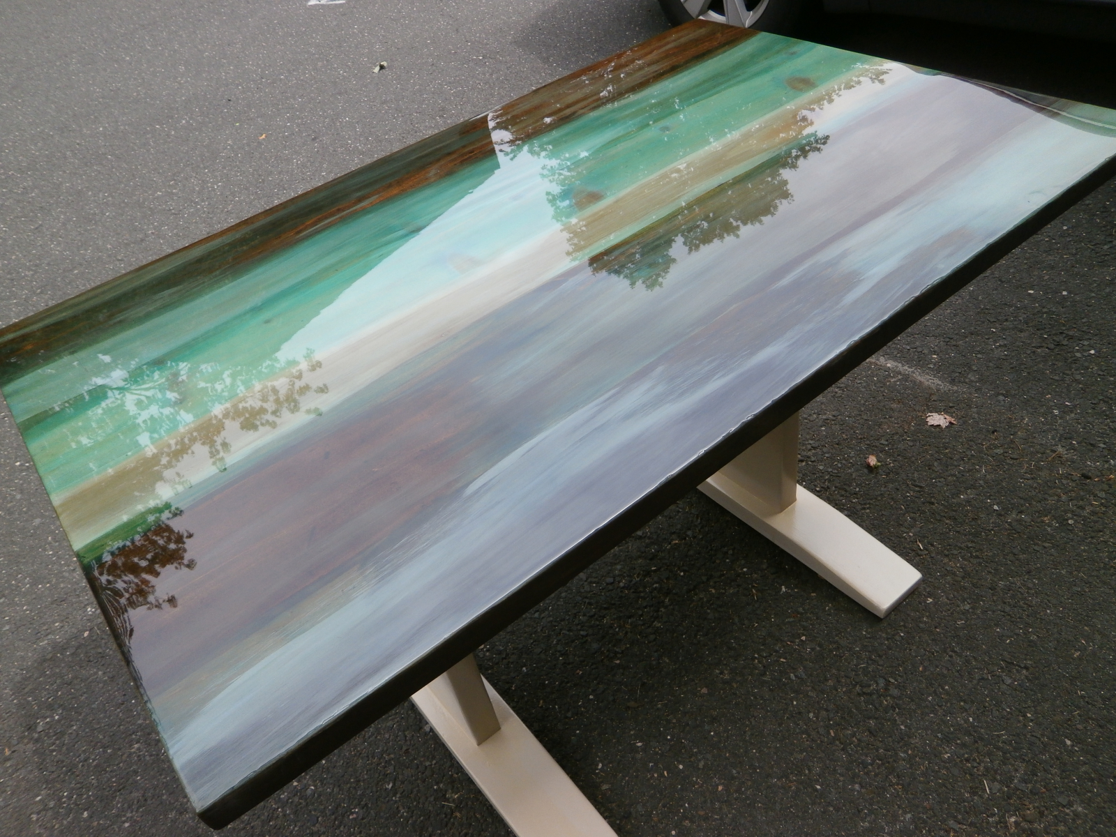 Used US Composites Bar Top Epoxy on table top. You can see the reflection of the trees outside.