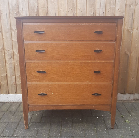 Before shot of the coral and black chest of drawers