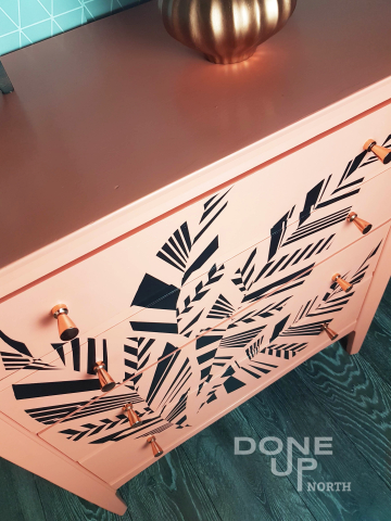 Coral and black chest of drawers