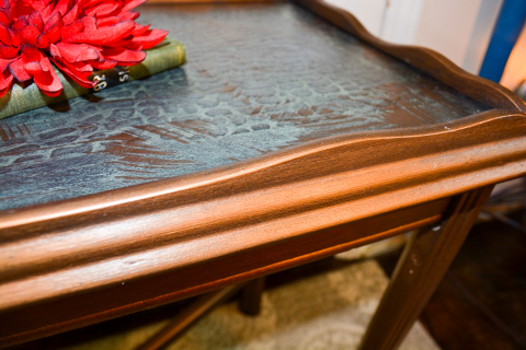 Close up of alligator texture and bronze finish