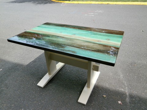 The chalk paint color compliments the colors on the top of the table beautifully.