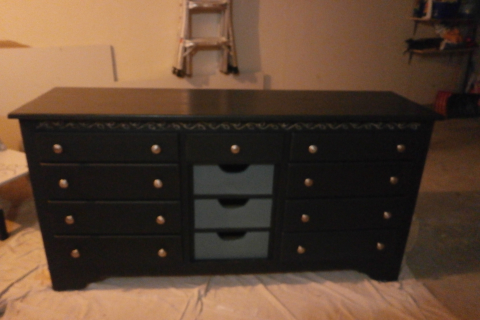 Before installing the door that covers the middle drawers
