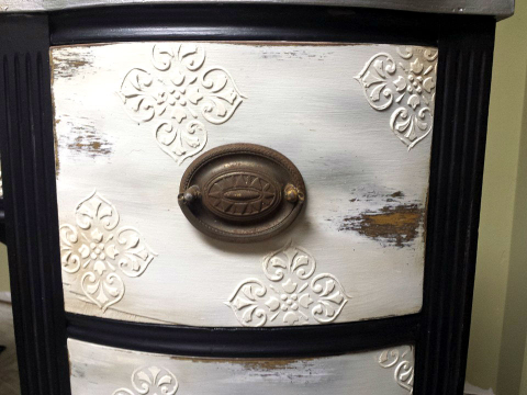 Drawer front with the raised stencil